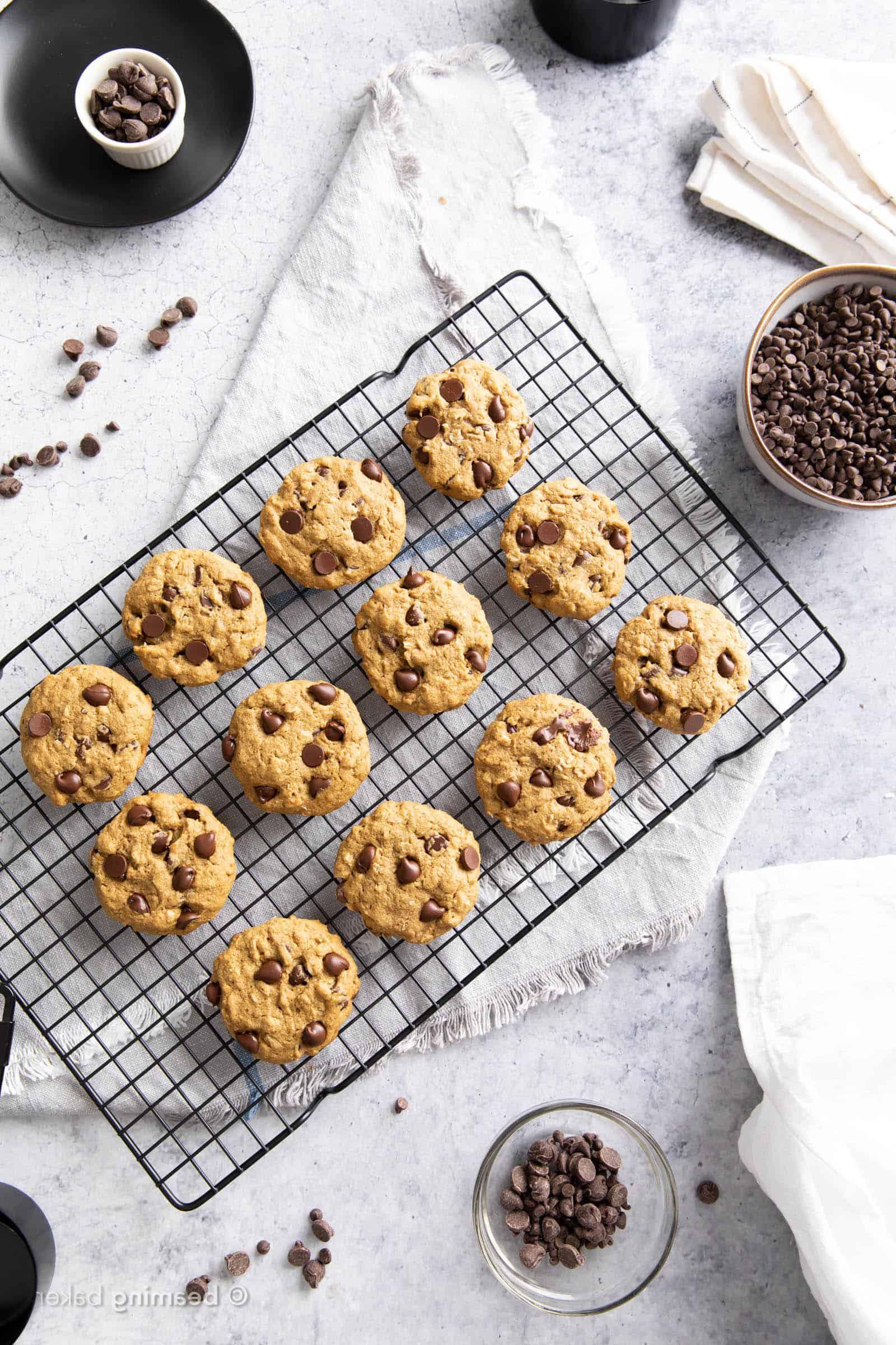 fresh baked oat flour cookies with chocolate chips in bowls and kitchen towels