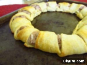 Baked tuna crescent ring on a sheet tray, perfectly golden brown and ready to be served.