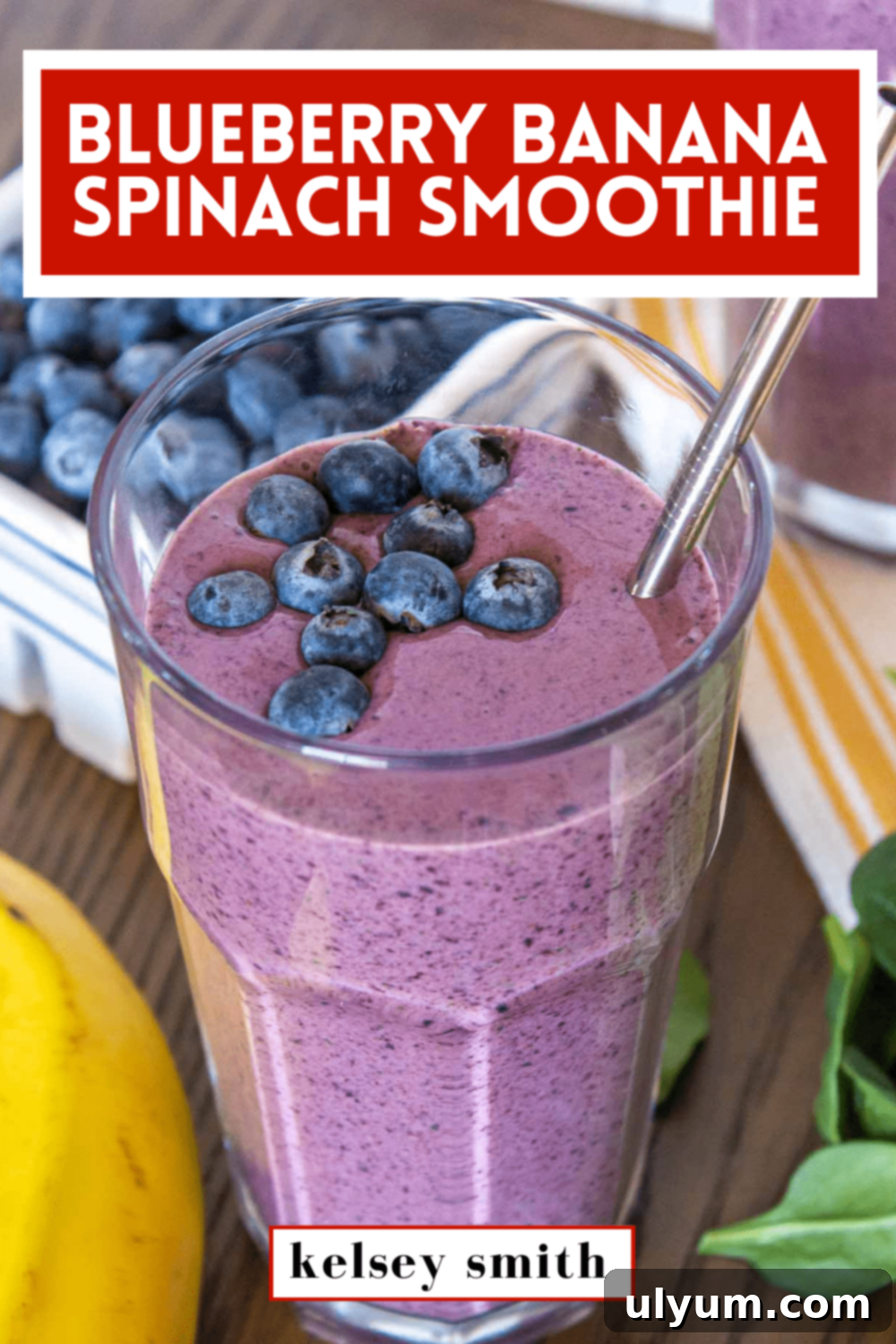 Blueberry banana spinach smoothie in a 16 ounce cup. Text at the top says Blueberry Banana Spinach Smoothie.