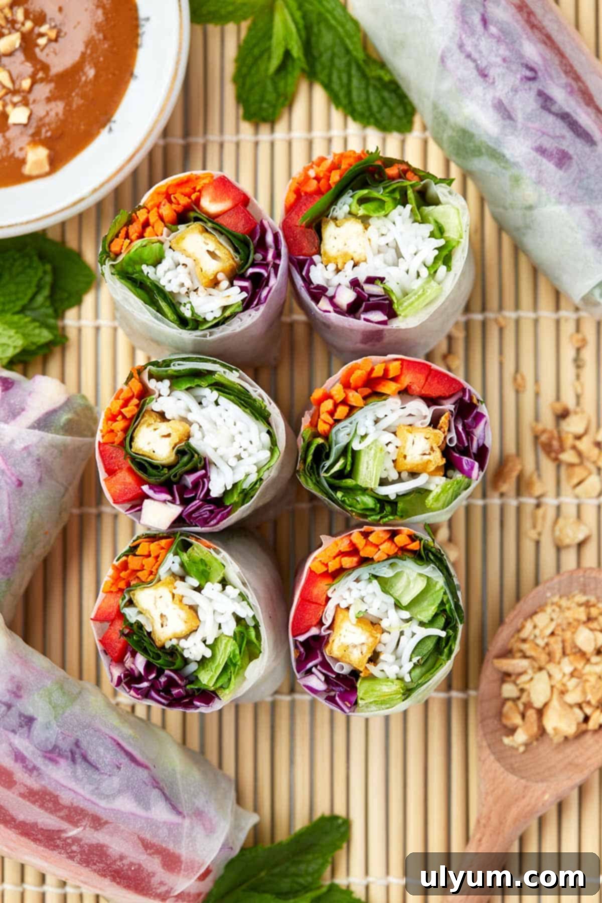 Spring rolls cut in half, revealing the fresh fillings.