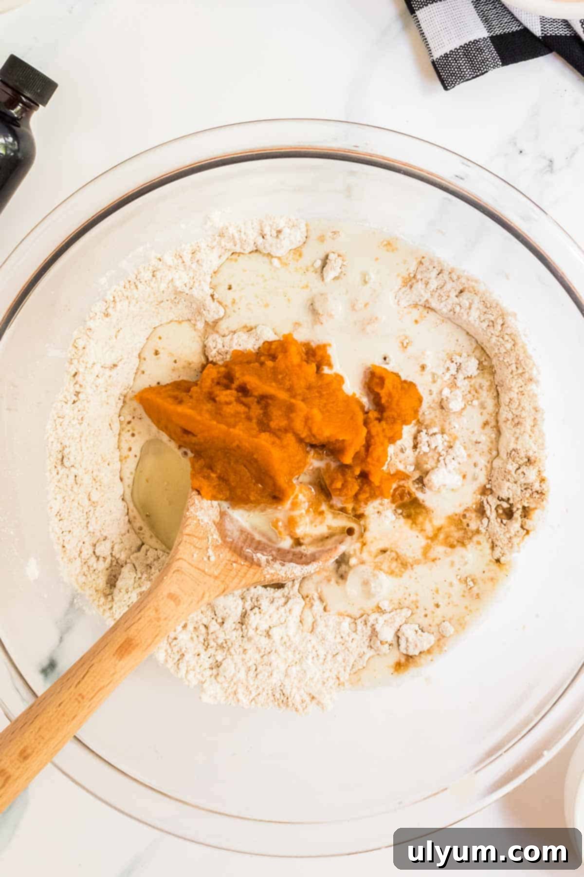 Spiced Baked Pumpkin Donuts with Velvety Cream Cheese Frosting 6 Dry and wet ingredients in mixing bowl.