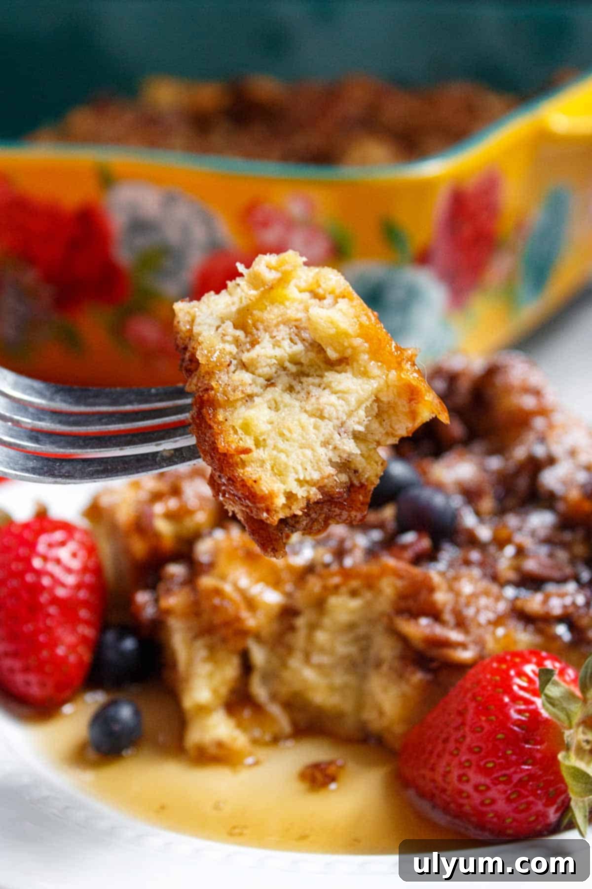 Bite of French toast casserole on a fork.