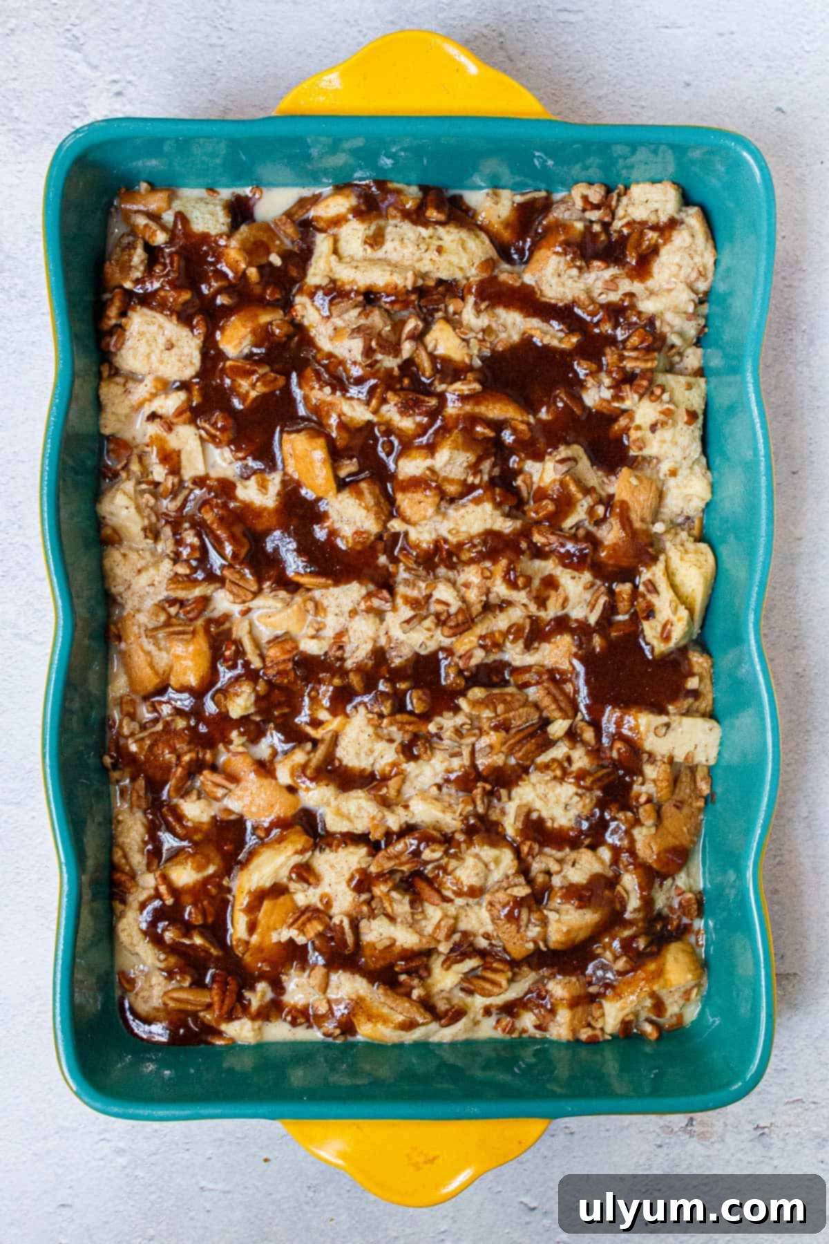 Brown sugar butter mixture drizzled over French toast casserole.