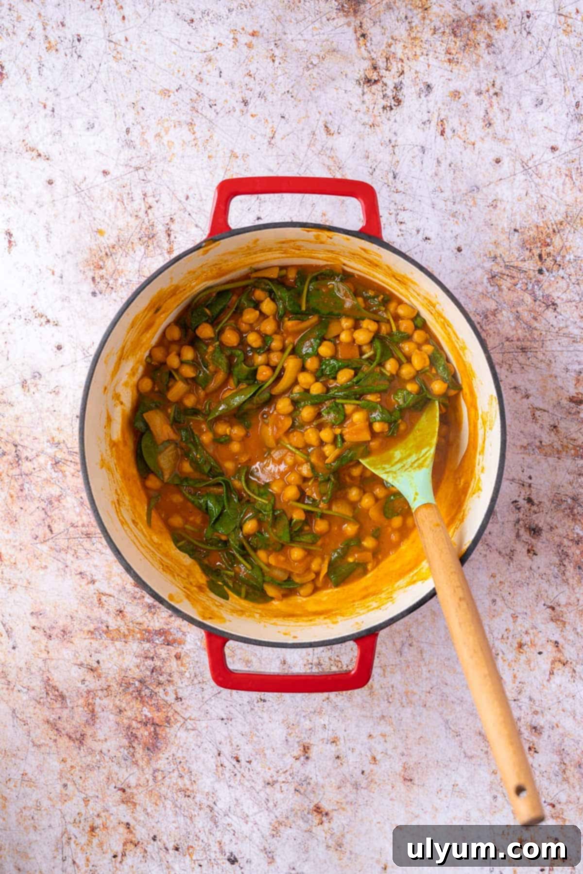Vibrant Coconut Chickpea & Spinach Curry 11 The vibrant green spinach leaves perfectly wilted into the rich, creamy chickpea curry.