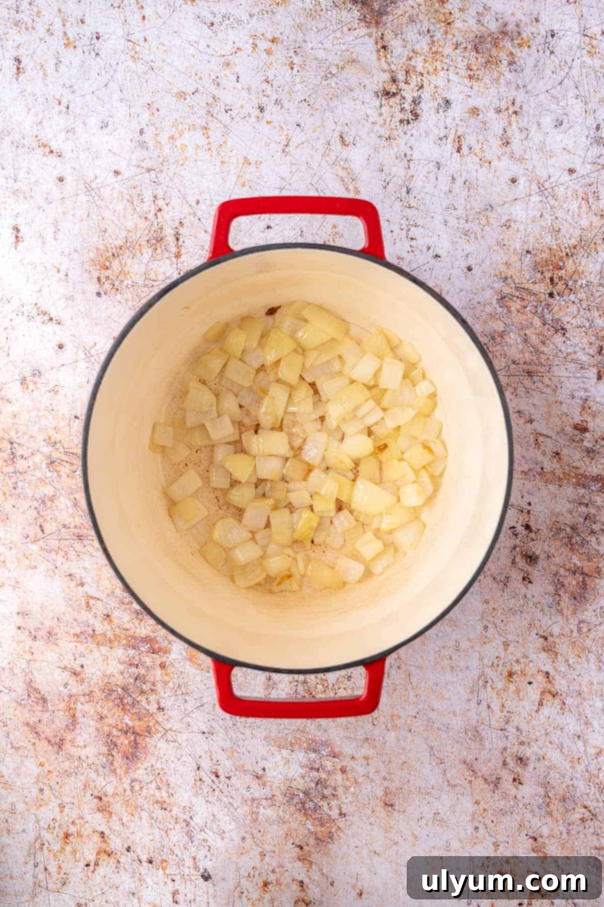Vibrant Coconut Chickpea & Spinach Curry 4 Finely chopped yellow onion sautéing in olive oil until translucent in a large saucepan.