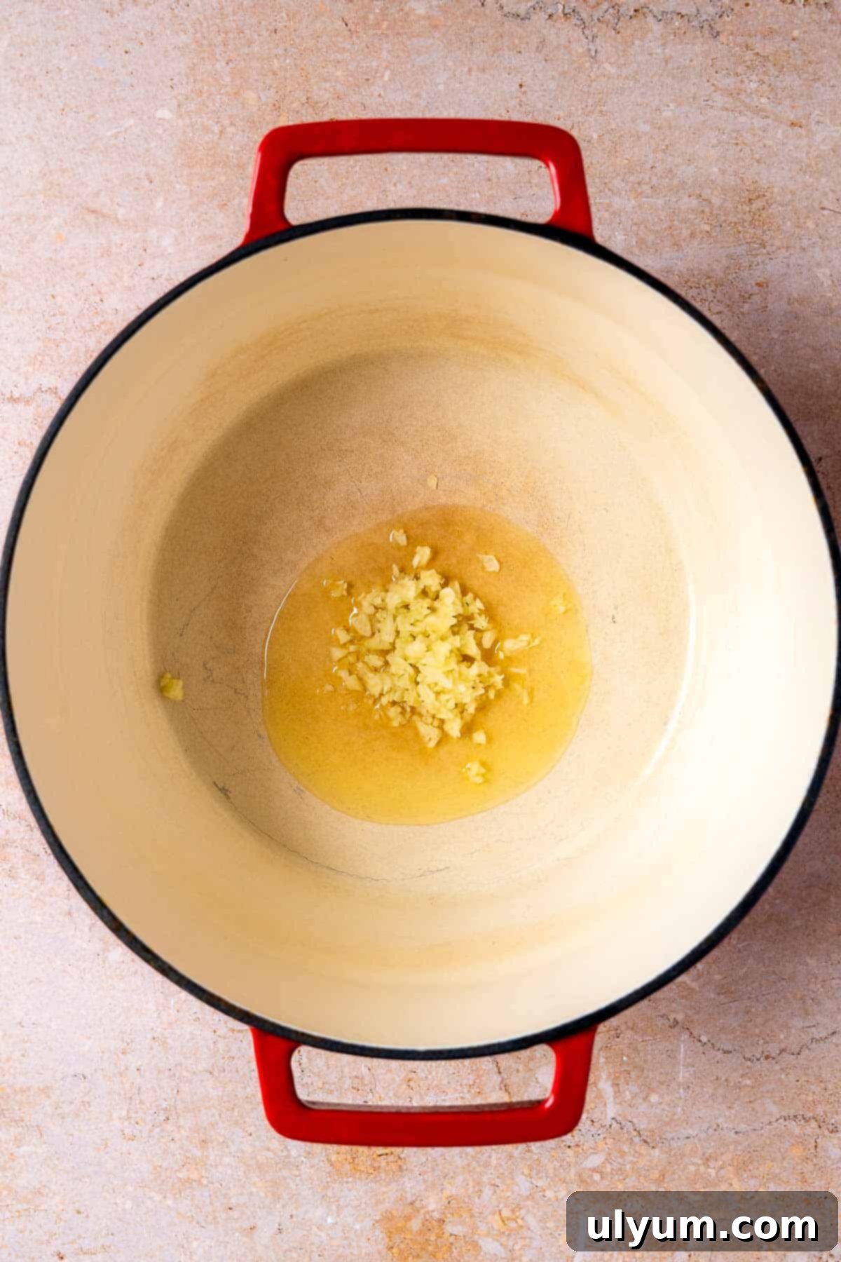 Garlic in olive oil in a large pot.