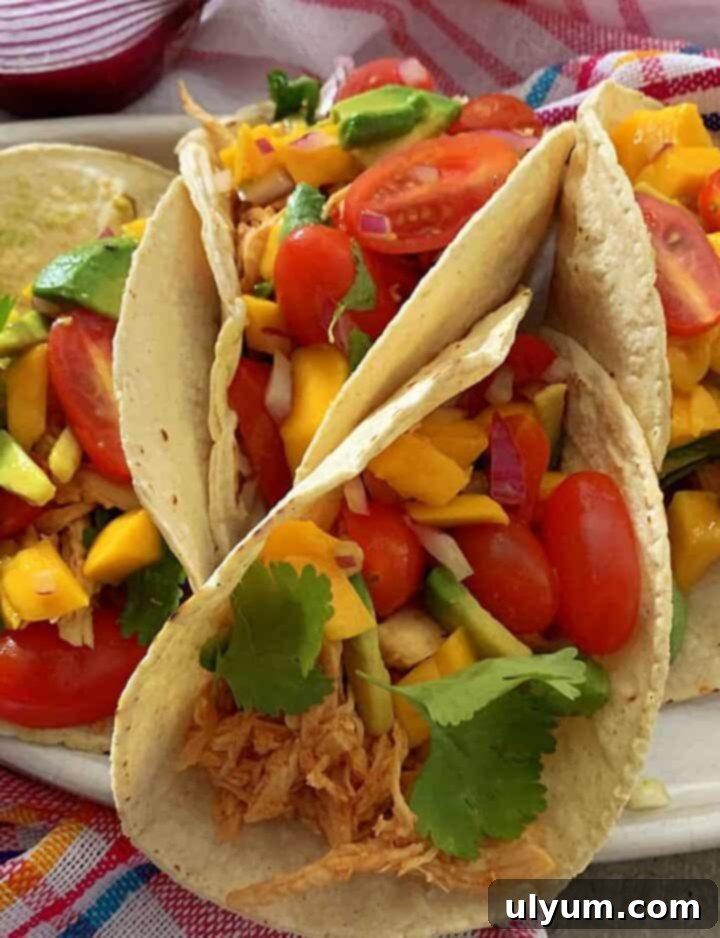 Colorful Instant Pot Chicken Tacos with fresh toppings