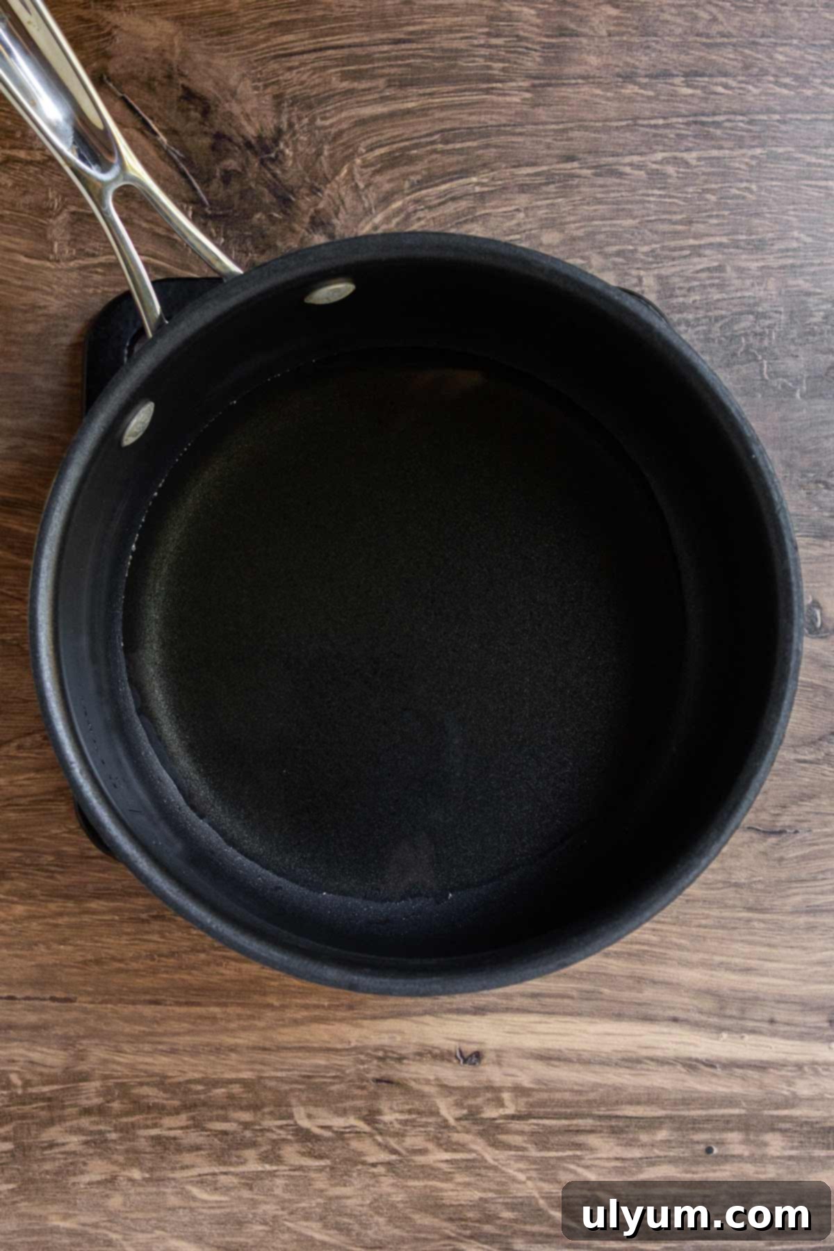 Bacon grease heated in a saucepan over medium-low heat