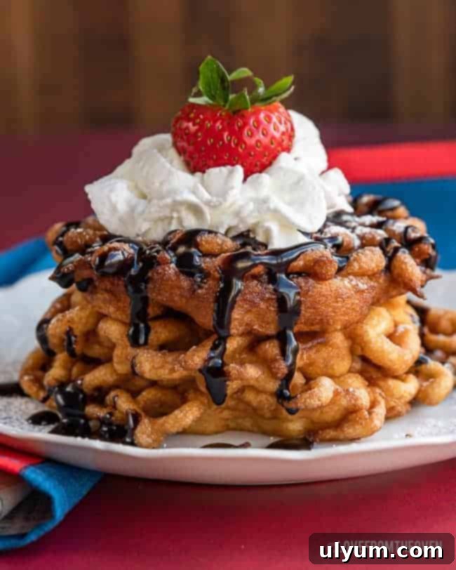 Classic funnel cake made from pancake mix, dusted with powdered sugar.