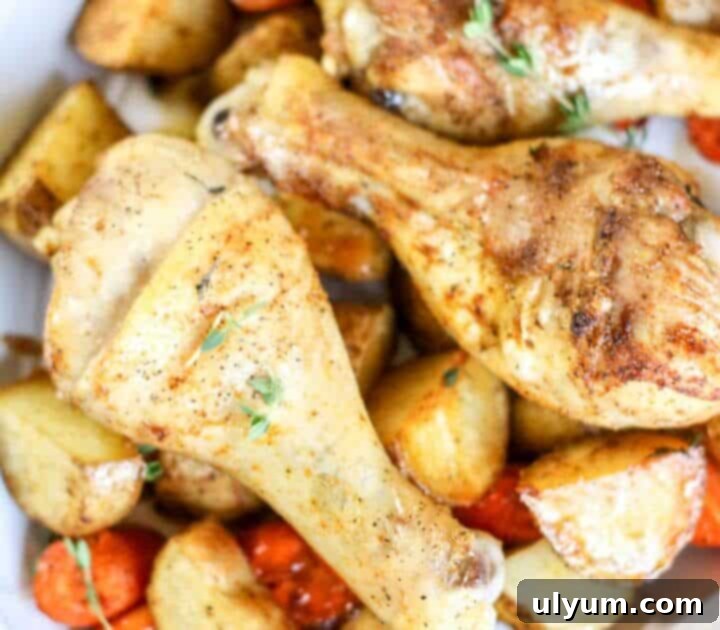 41 Easy Sheet Pan Dinner Ideas 11 Chicken Drumsticks with Potatoes and Carrots