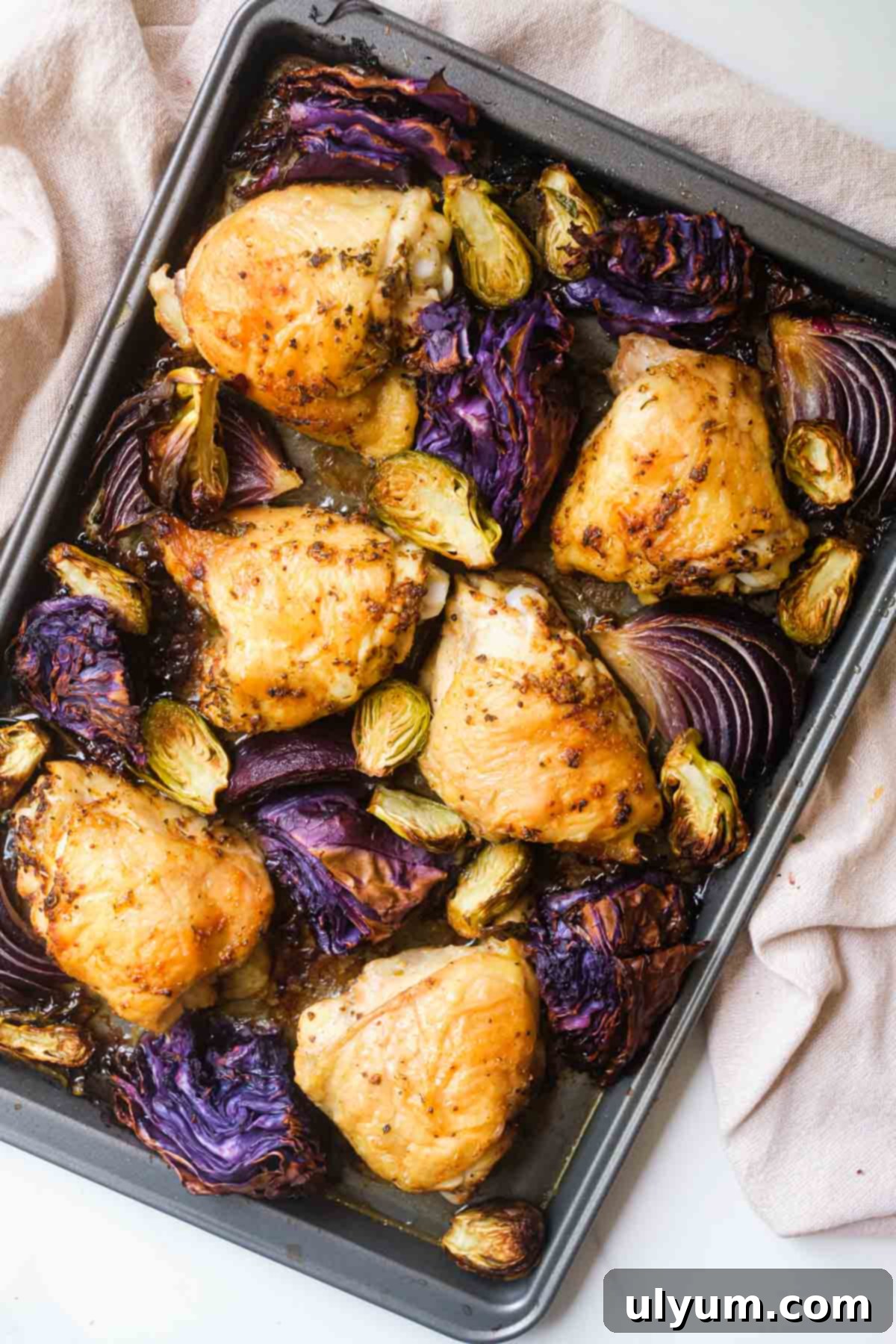 41 Easy Sheet Pan Dinner Ideas 14 Chicken Thighs with Brussels and Cabbage