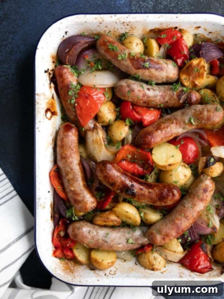 41 Easy Sheet Pan Dinner Ideas 29 Oven Roasted Sausage and Potatoes with Bell Peppers and Onions