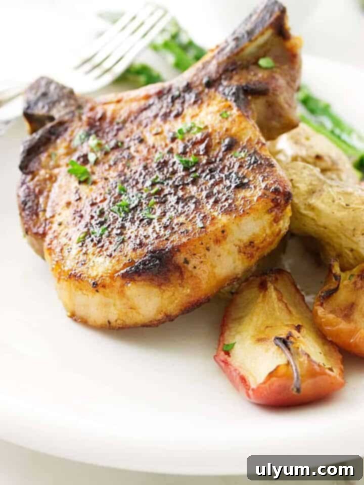 41 Easy Sheet Pan Dinner Ideas 32 Chipotle Pork Chops and Apples with Fingerling Potatoes