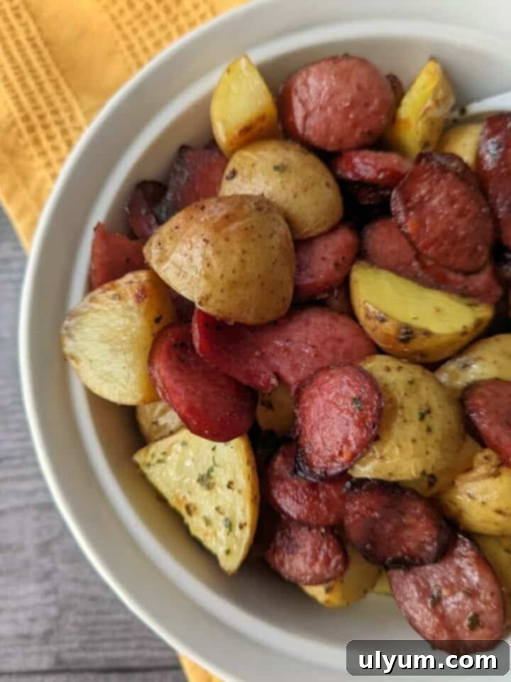 41 Easy Sheet Pan Dinner Ideas 33 Kielbasa and Potatoes with Onions