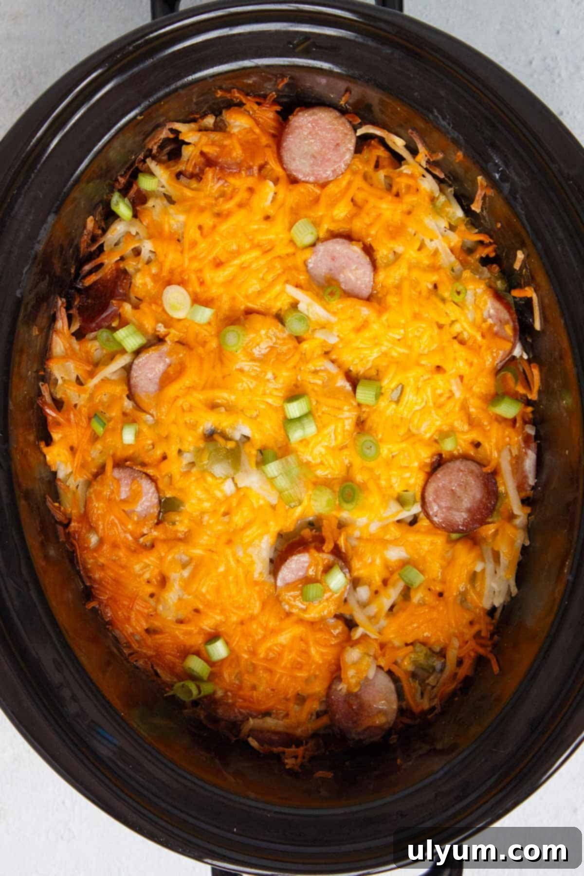 Cooked Slow Cooker Cheesy Kielbasa Hash Brown Casserole in the crock pot