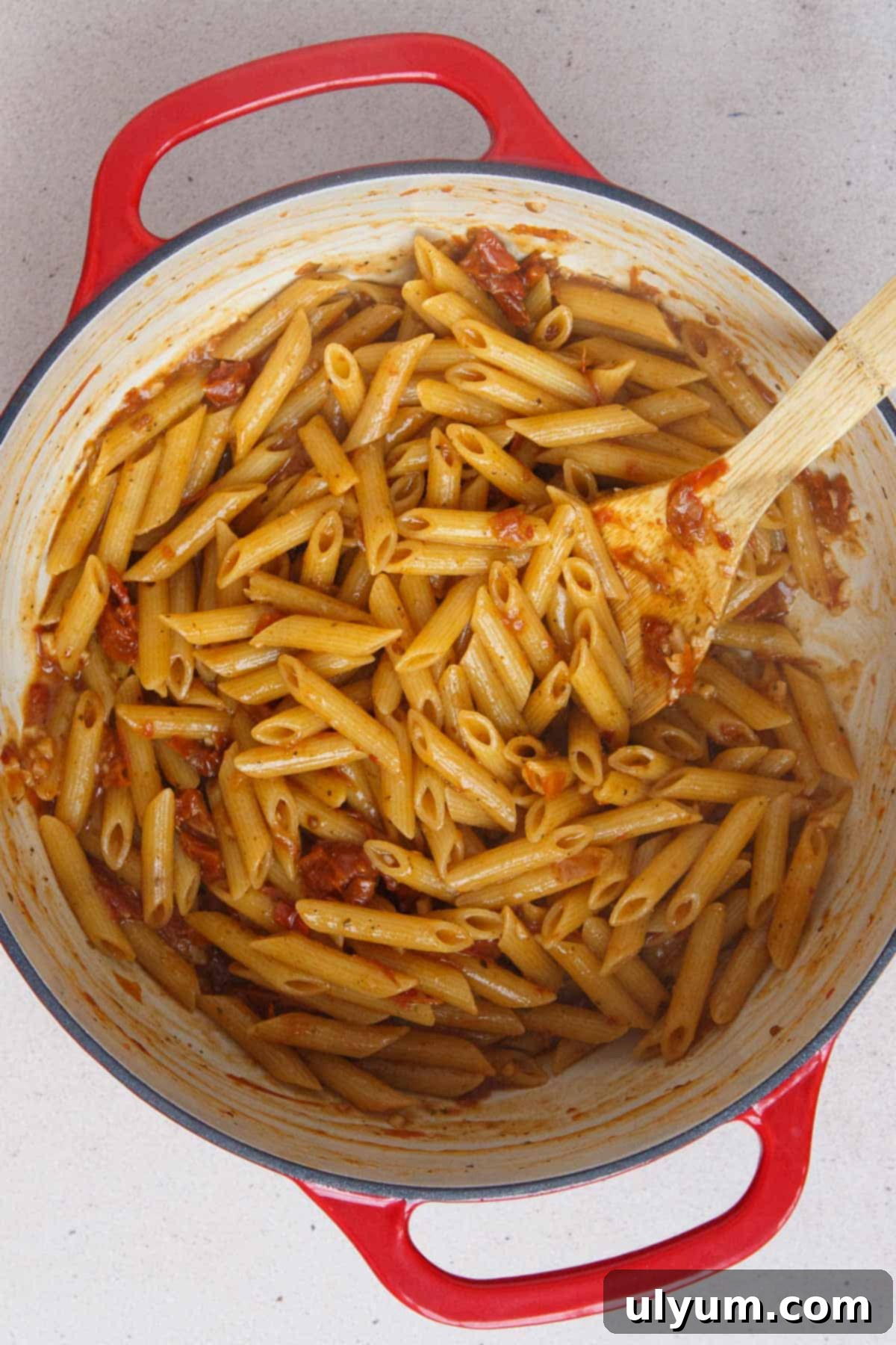 Effortless One-Pot Sun-Dried Tomato Pasta 8 Pasta cooked to al dente with absorbed broth, ready for cream and cheese