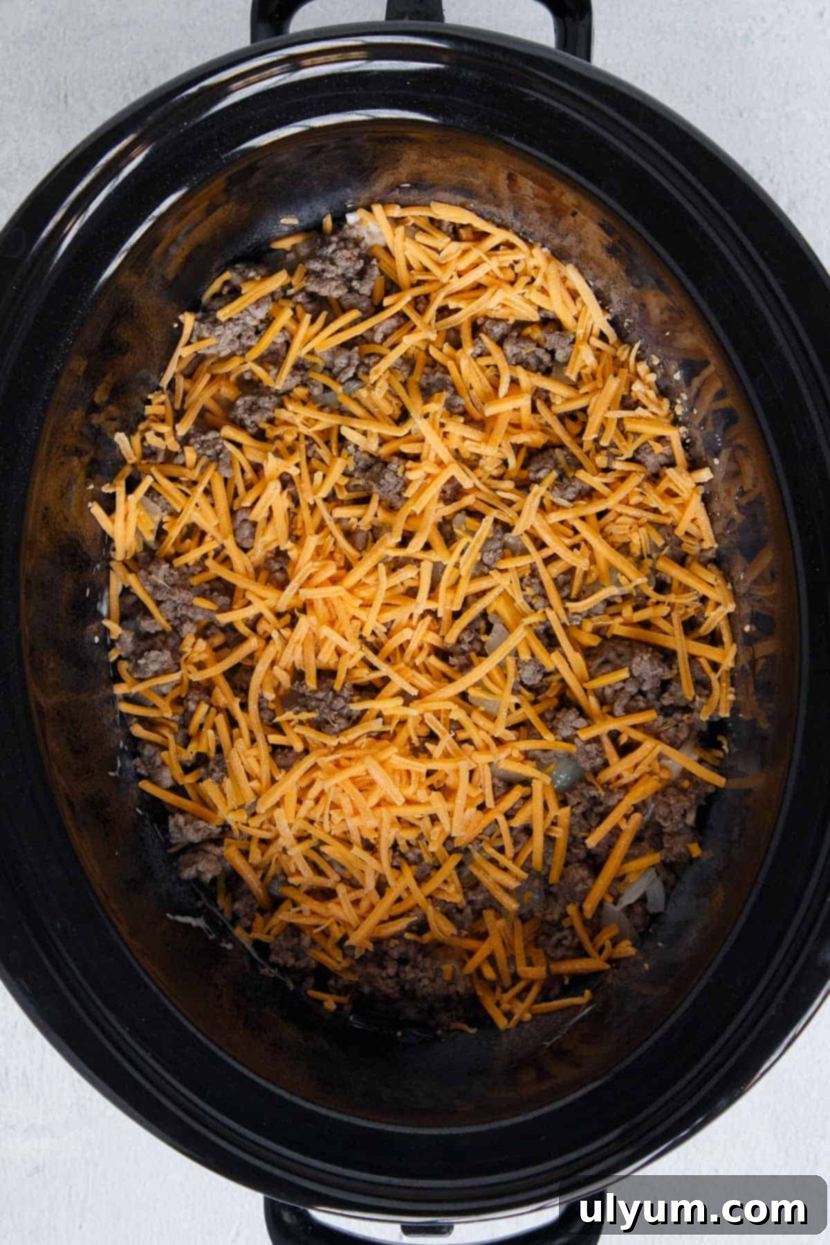 Crockpot Hamburger Hashbrown Casserole layer of beef and cheese