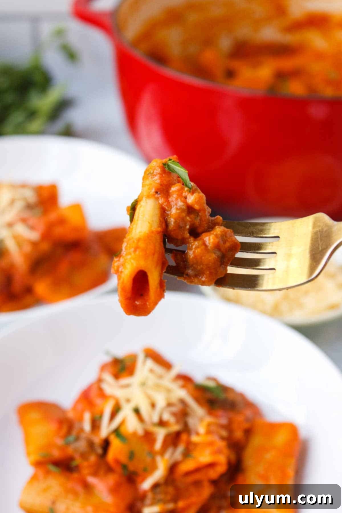 Creamy One-Pot Italian Sausage Pasta 12 Close-up of Creamy One Pot Rigatoni on a fork, showing the rich sauce and pasta texture.