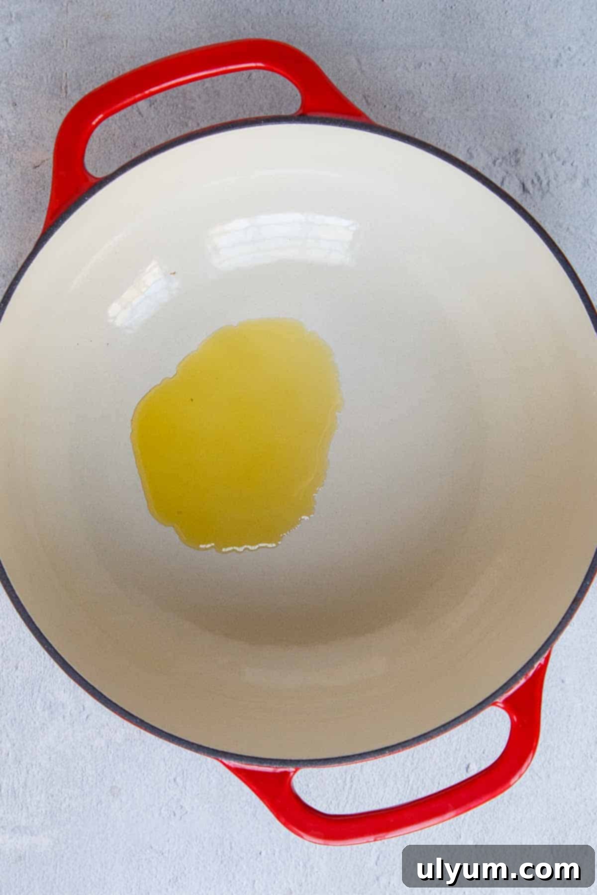 Creamy One-Pot Italian Sausage Pasta 4 Olive oil being heated in a large pot, ready for cooking.