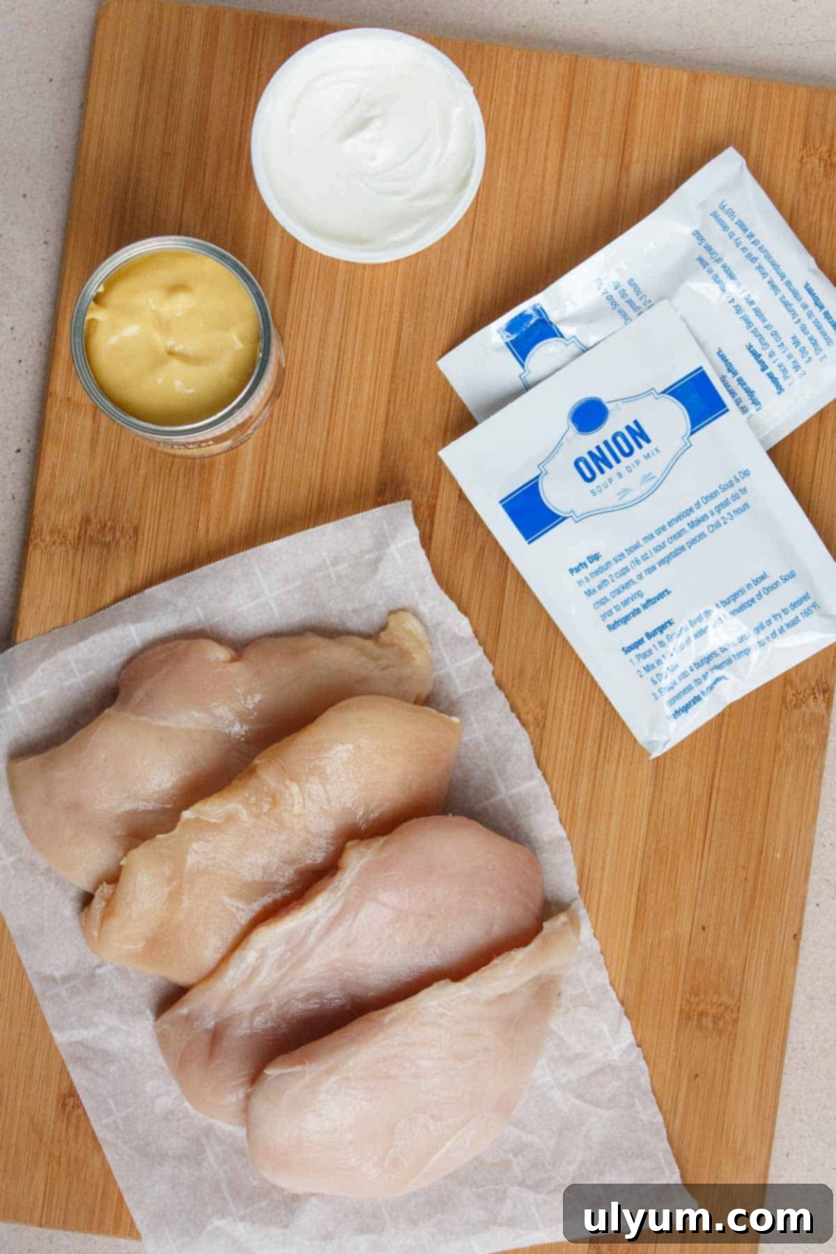 4-Ingredient Crockpot Chicken ingredients including chicken breasts, cream of chicken soup, sour cream, and onion soup mix