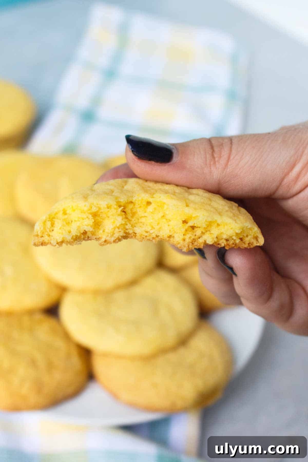 Lemon cookie bit in half to show soft texture