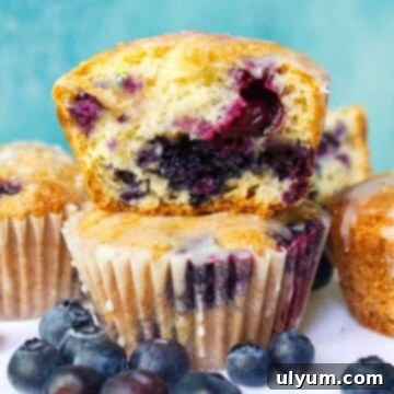 Delicious Cake Mix Blueberry Muffins with a lemon glaze, ready to enjoy.