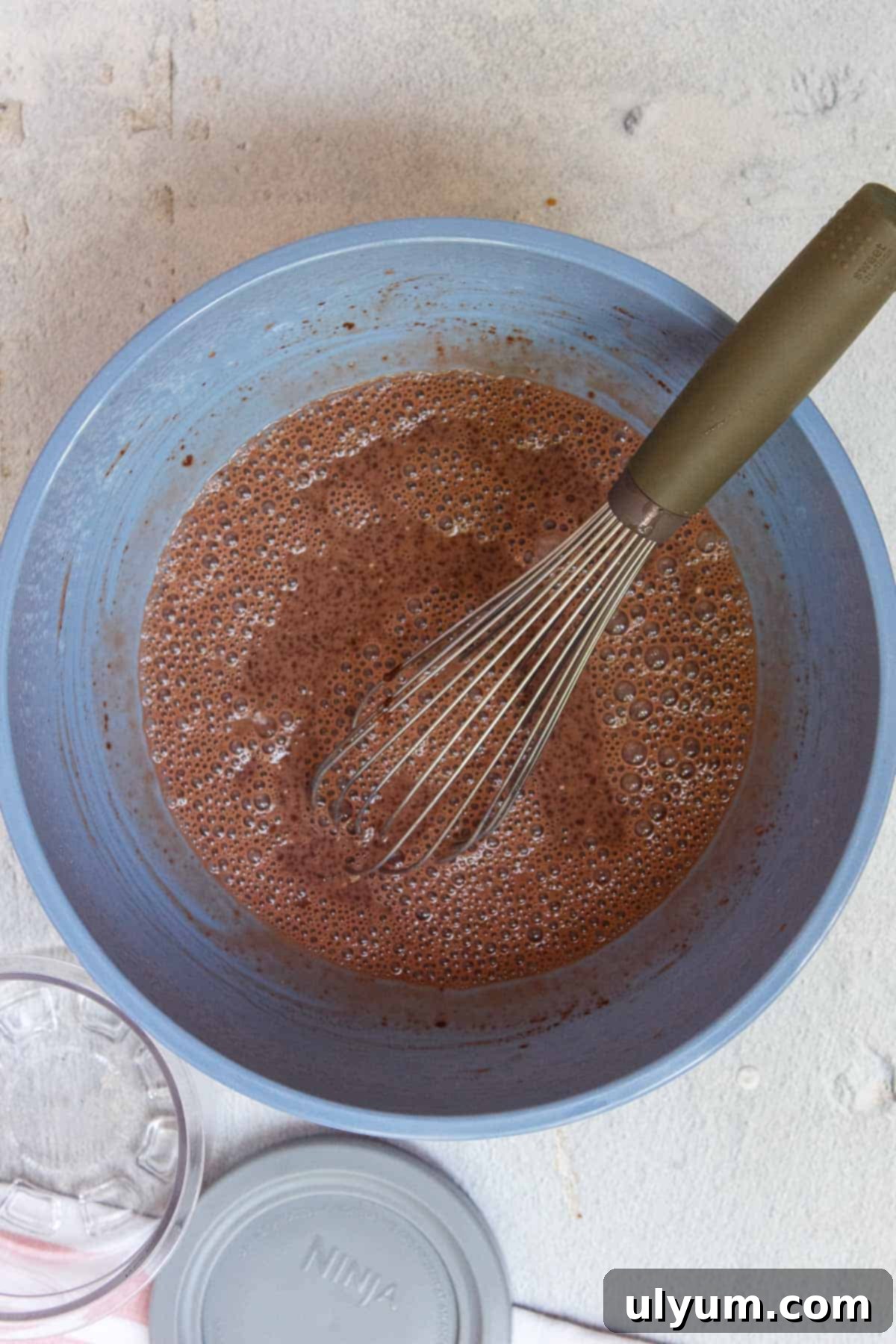 Liquid mixture for Ninja Creami Chocolate Protein Ice Cream settling to remove bubbles