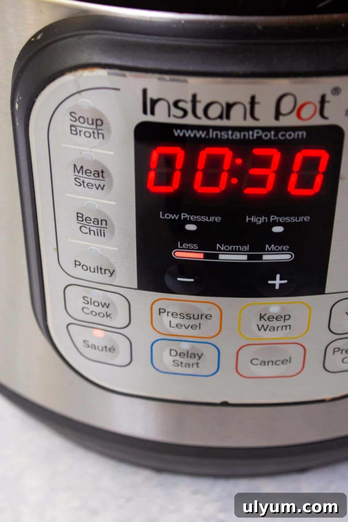 Instant Pot display showing it is set to Sauté on Less (low heat).