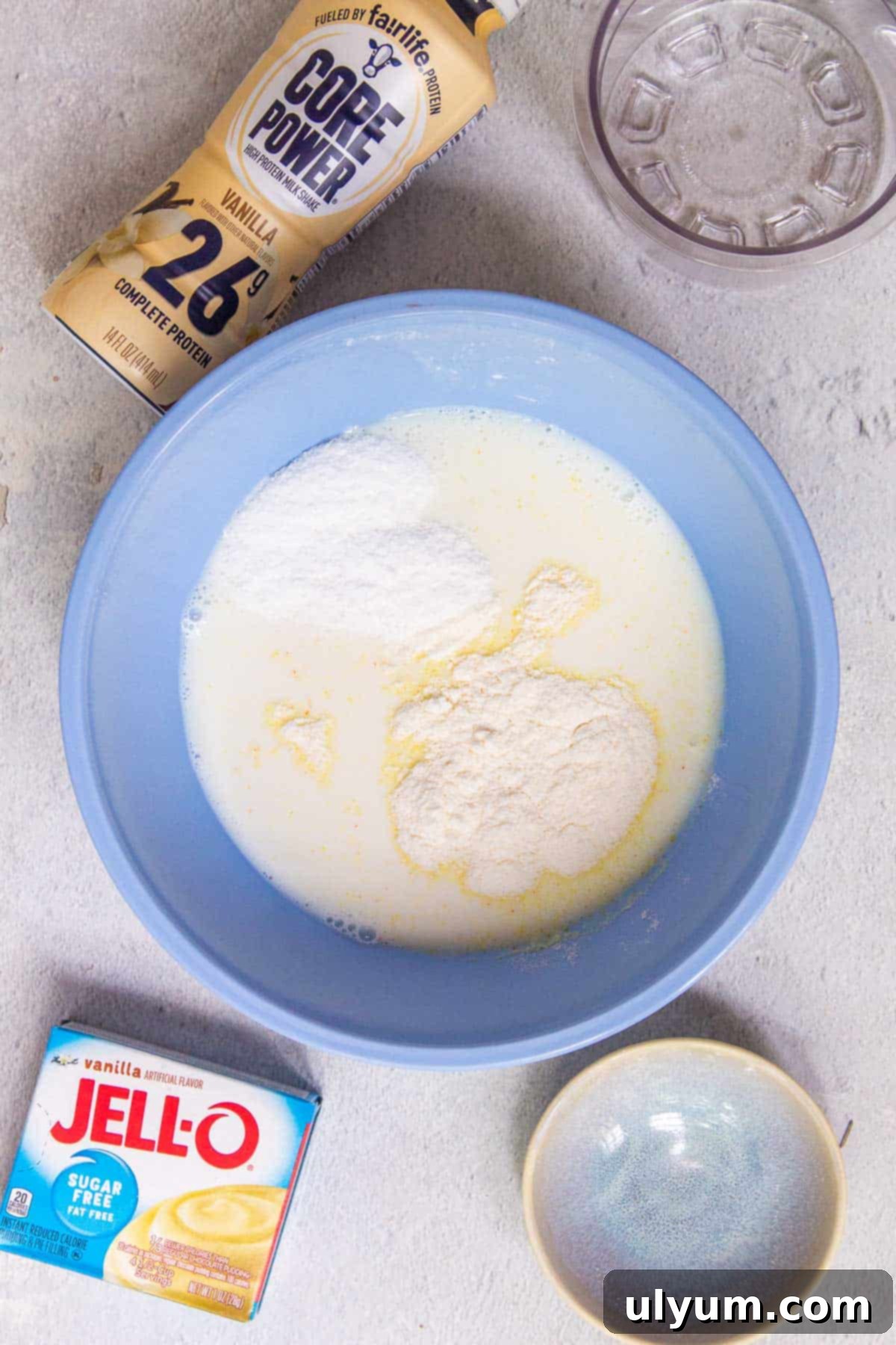 Ninja Creami Vanilla Protein Ice Cream ingredients being mixed in a bowl.