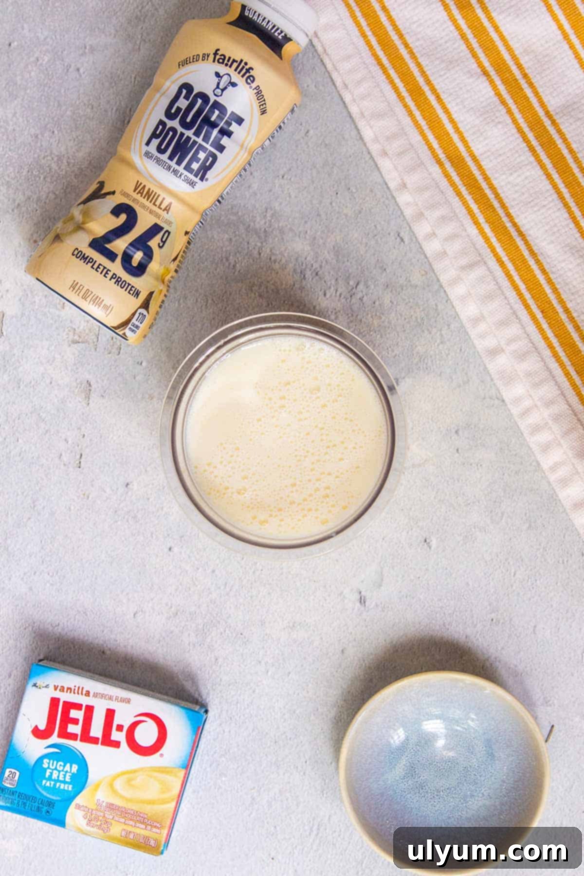 Ninja Creami Vanilla Protein Ice Cream mixture poured into a clean pint container.