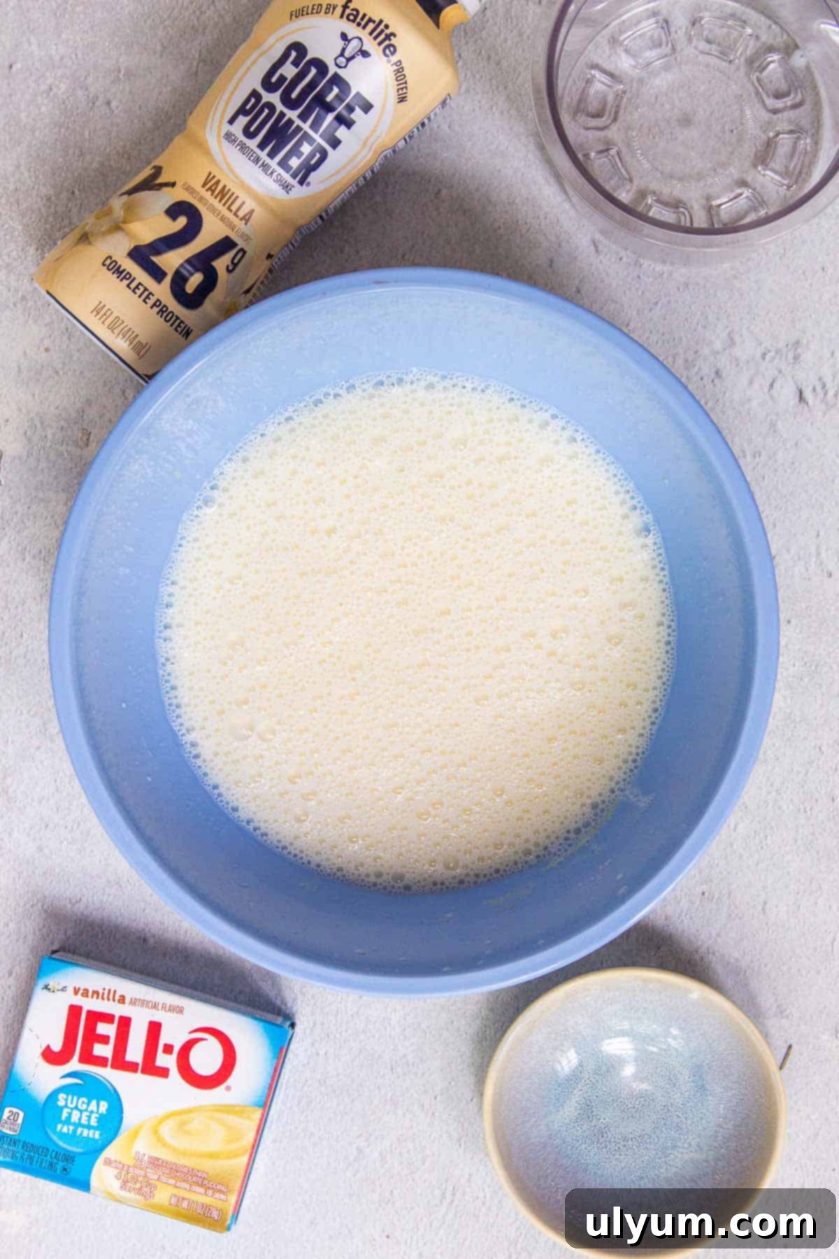 Ninja Creami Oreo Protein Ice Cream mixture with bubbles settling on the surface