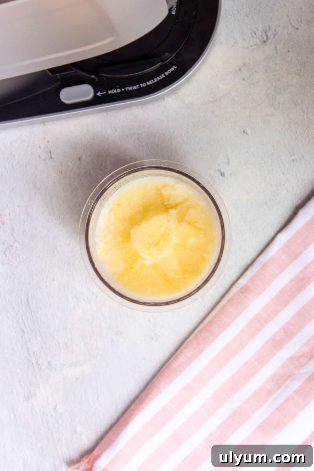 Frozen pint of vanilla protein ice cream base, solid and ready for the Ninja Creami machine