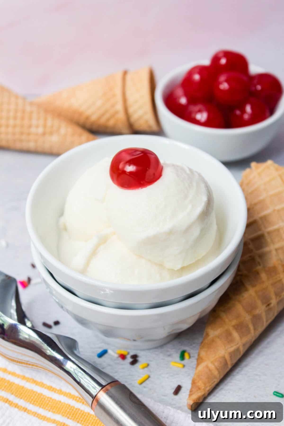 Ninja Creami Vanilla Ice Cream with a cherry on top, showcasing its creamy texture