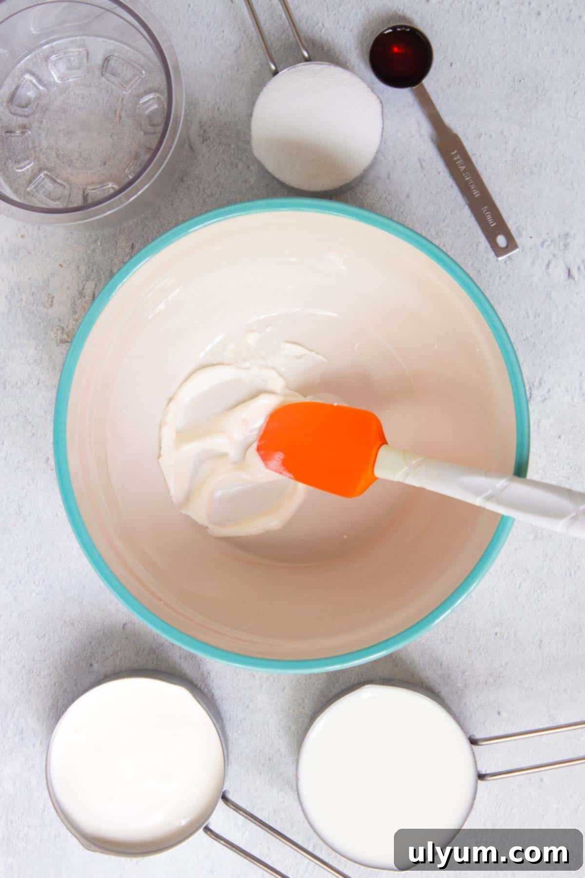 Cream cheese is softened in a large mixing bowl