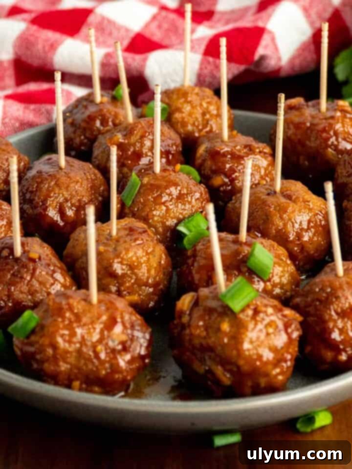 Effortless Frozen Meatball Meals 17 Ways 12 Crock Pot Honey Garlic Meatballs glistening in a sweet and savory sauce.