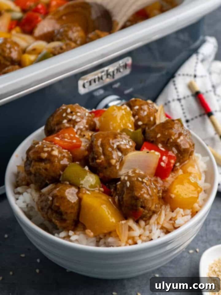 Effortless Frozen Meatball Meals 17 Ways 9 Crock Pot Sweet and Sour Meatballs served over rice with green onions.