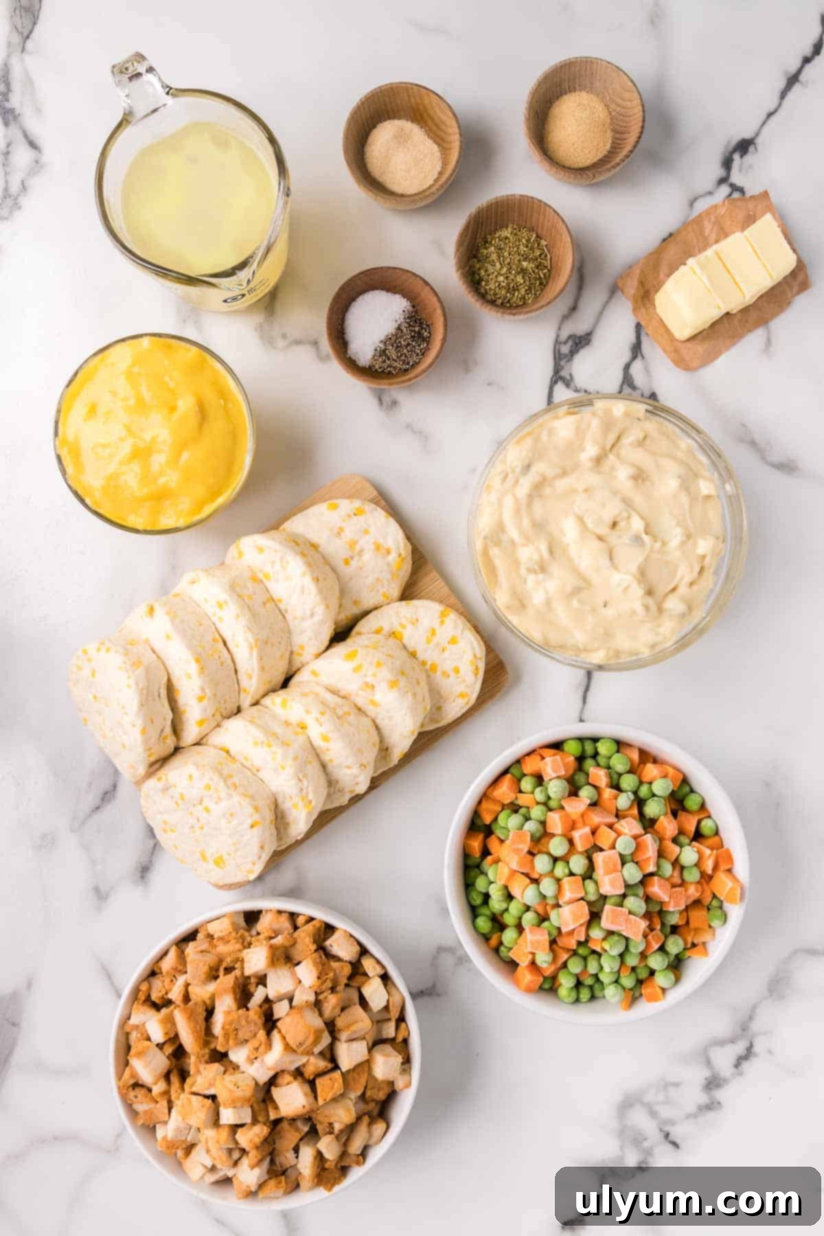 All ingredients for easy chicken pot pie casserole laid out on a table