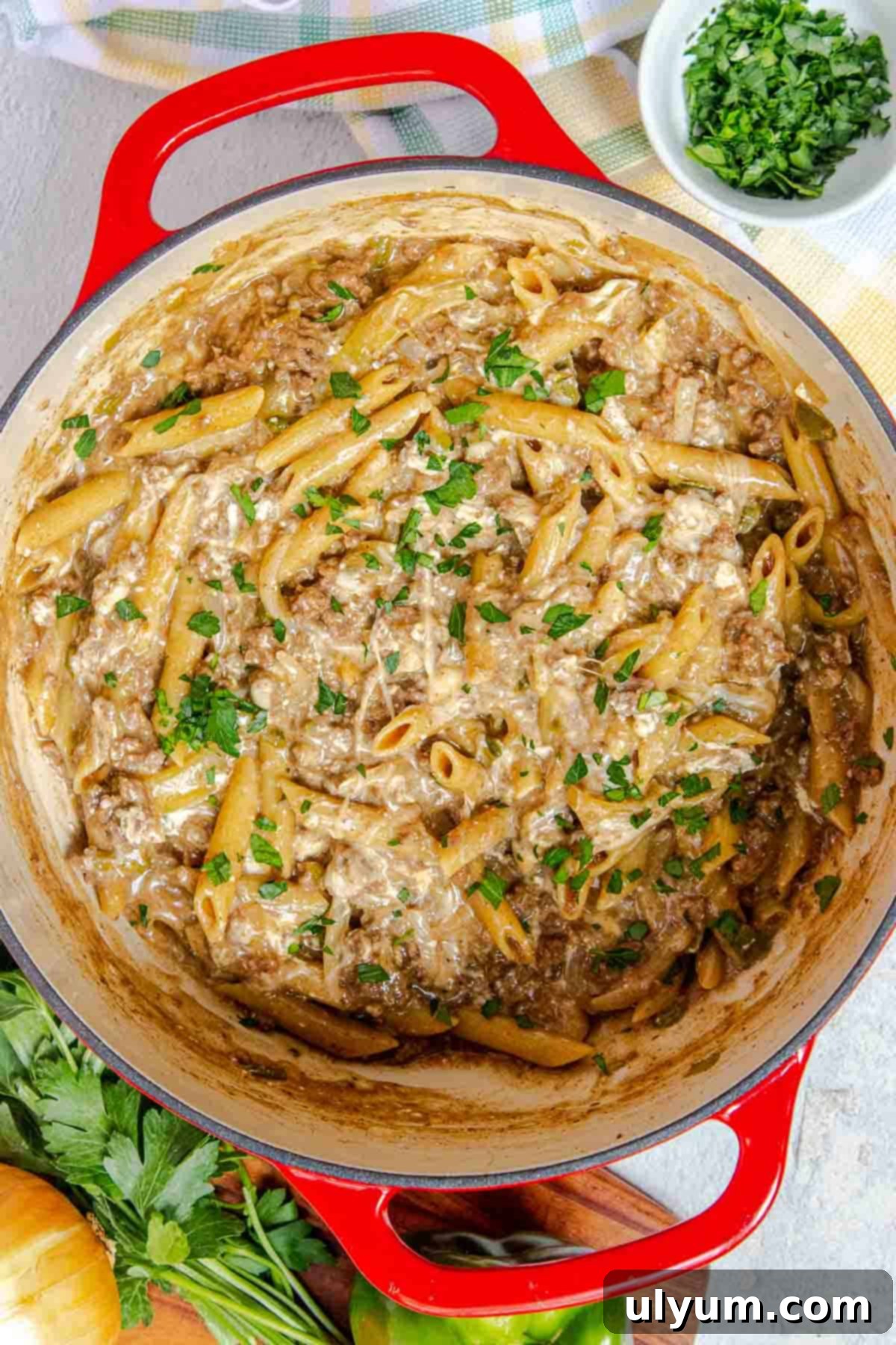 One Pot Philly cheesesteak pasta garnished with chopped fresh parsley