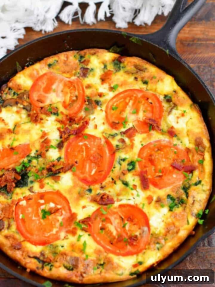 A delicious Tomato Bacon Frittata, brimming with vegetables and savory bacon, perfect for breakfast or brunch.