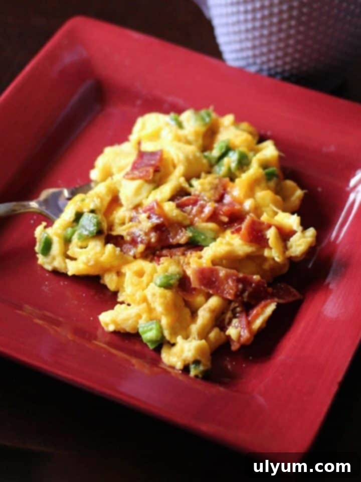 A vibrant Bacon Jalapeño Egg Scramble, a savory and slightly spicy breakfast option.