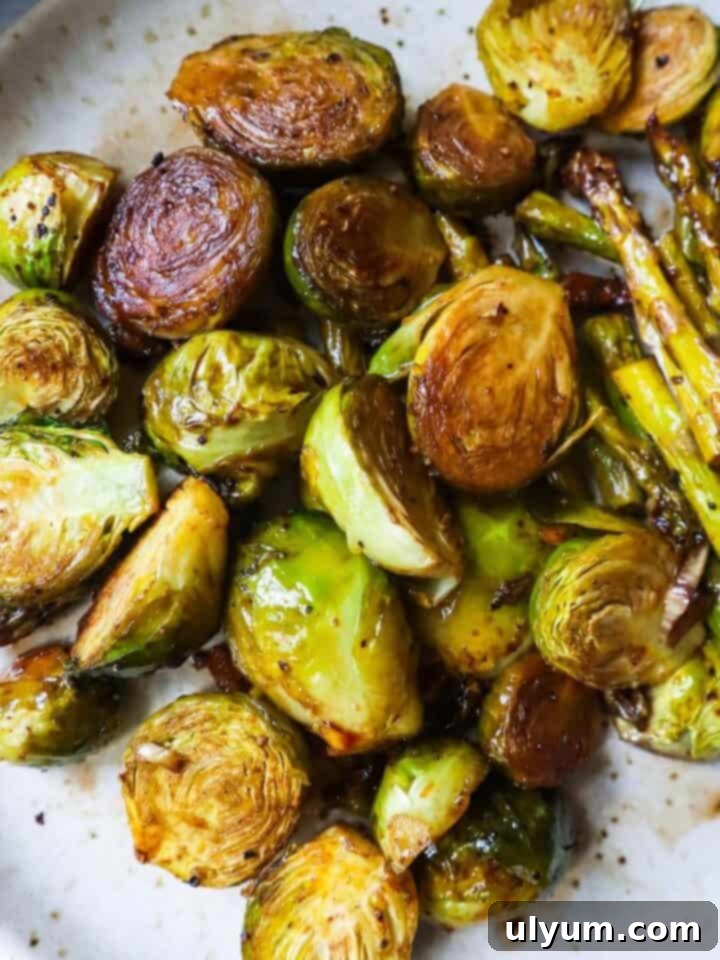 Roasted Asparagus and Brussels Sprouts, an easy 20-minute side dish with garlic, olive oil, and balsamic vinegar.