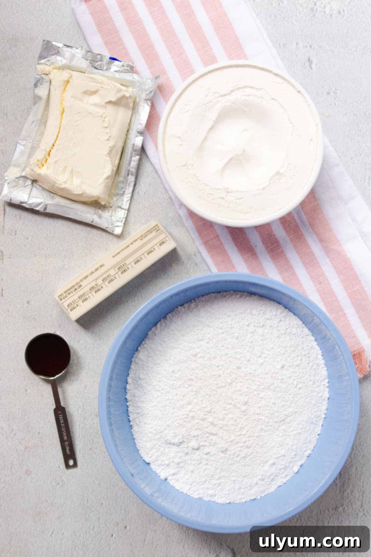 Cool Whip Cream Cheese Frosting 3 Cool Whip Cream Cheese Frosting ingredients laid out on a table