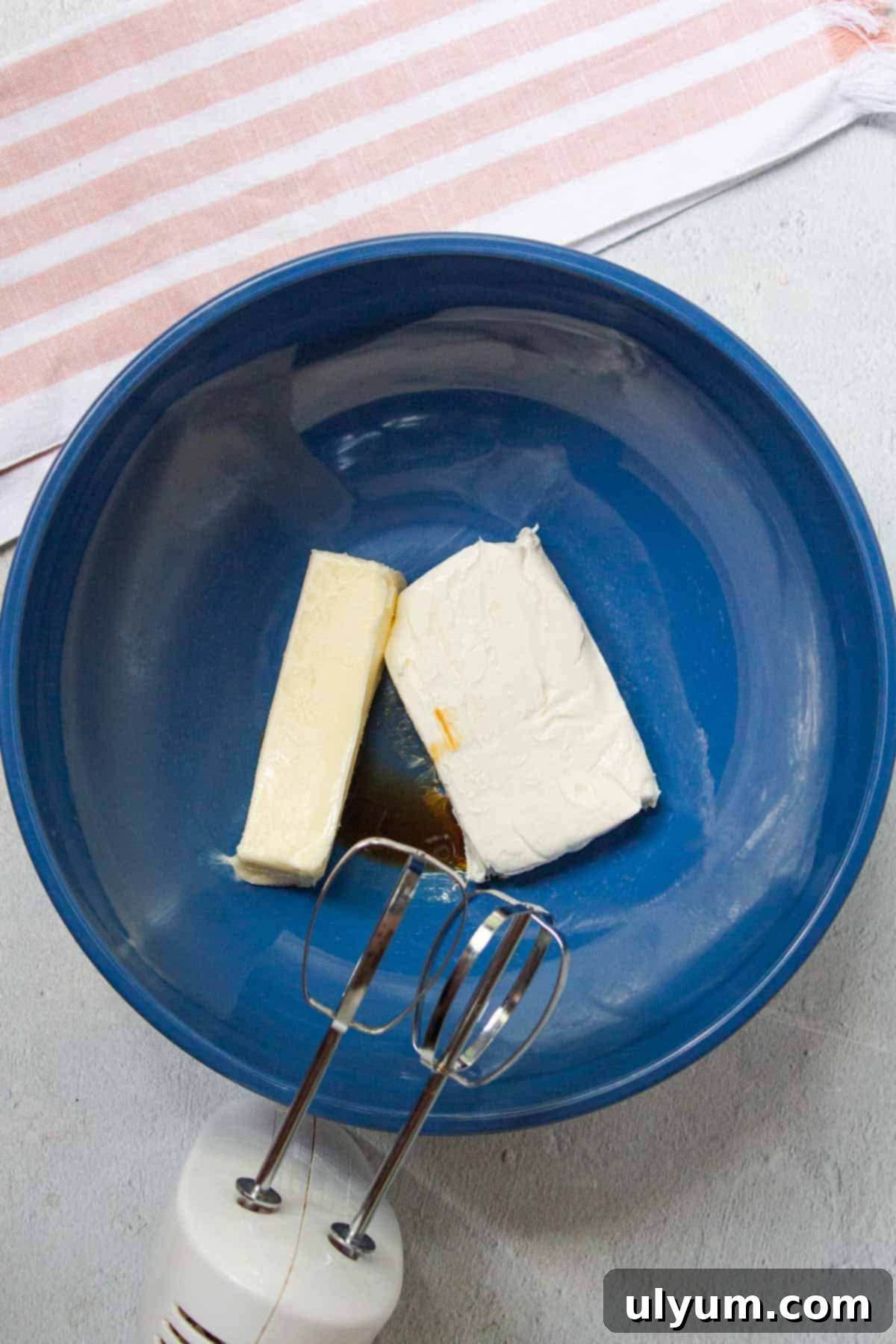 Cool Whip Cream Cheese Frosting 4 Softened butter, softened cream cheese, and vanilla extract are added to a large mixing bowl, ready for beating.