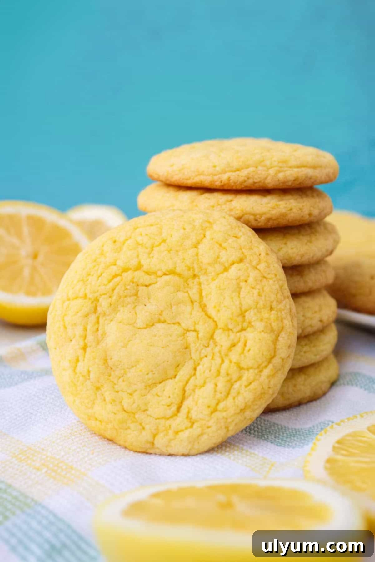 A selection of colorful 3-ingredient lemon cake mix cookies, some topped with icing.