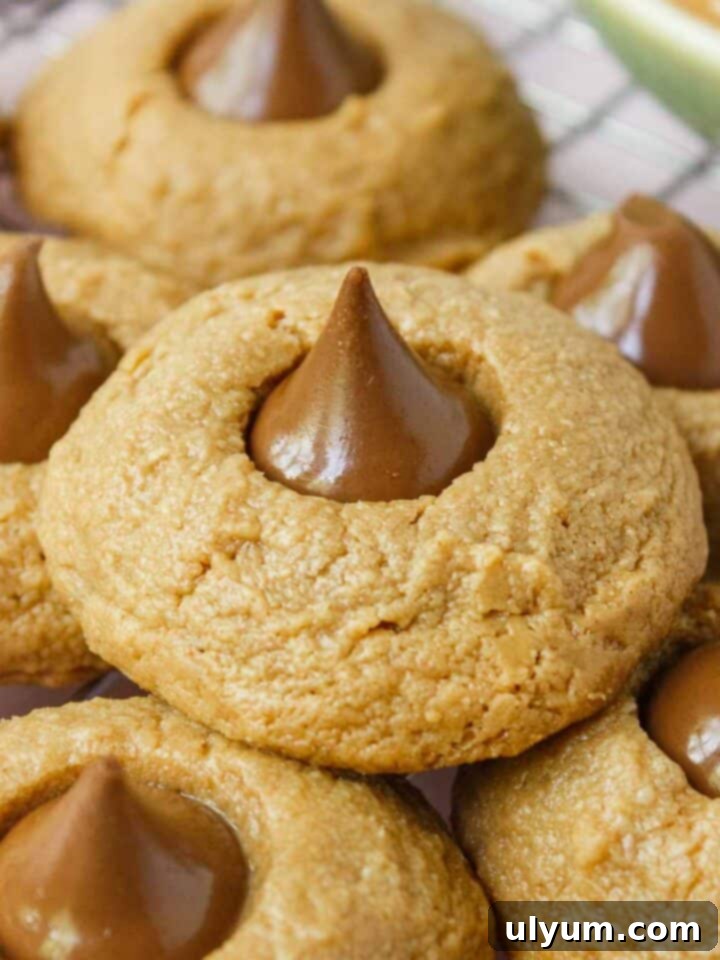 Classic 3-ingredient peanut butter blossoms with a chocolate kiss on top.