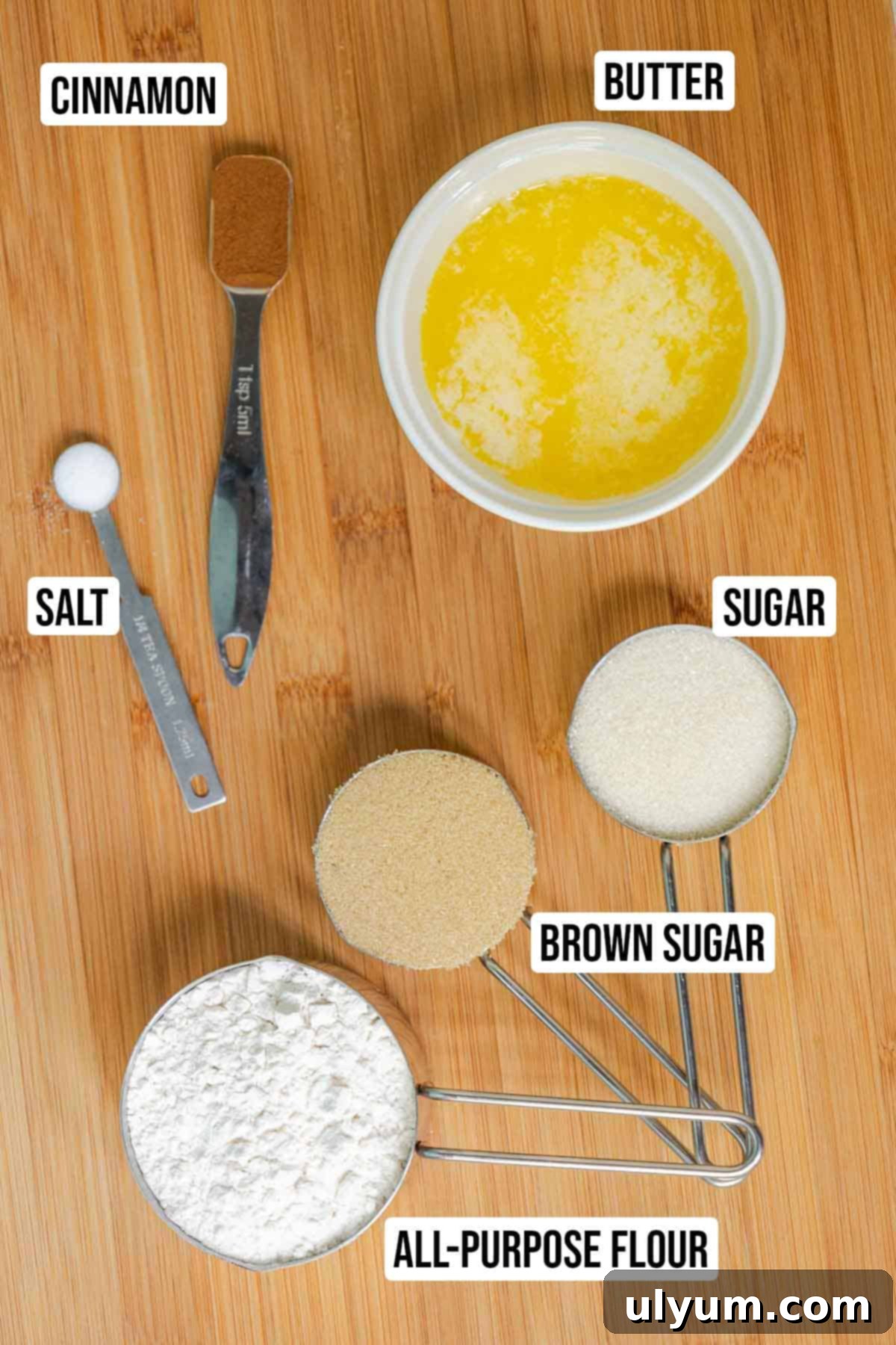 Individual ingredients for the cinnamon crumble topping for banana coffee cake, including all-purpose flour, light brown sugar, granulated sugar, ground cinnamon, salt, and melted unsalted butter.