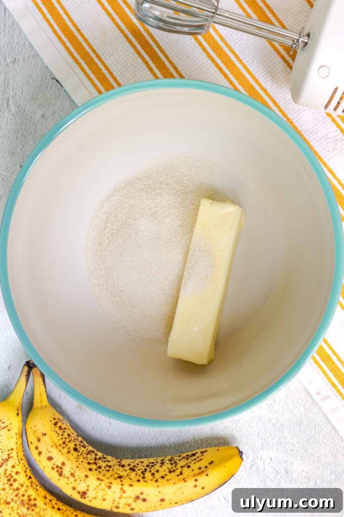 Softened unsalted butter and Zulka Morena Pure Cane Sugar in a large mixing bowl, ready to be creamed.