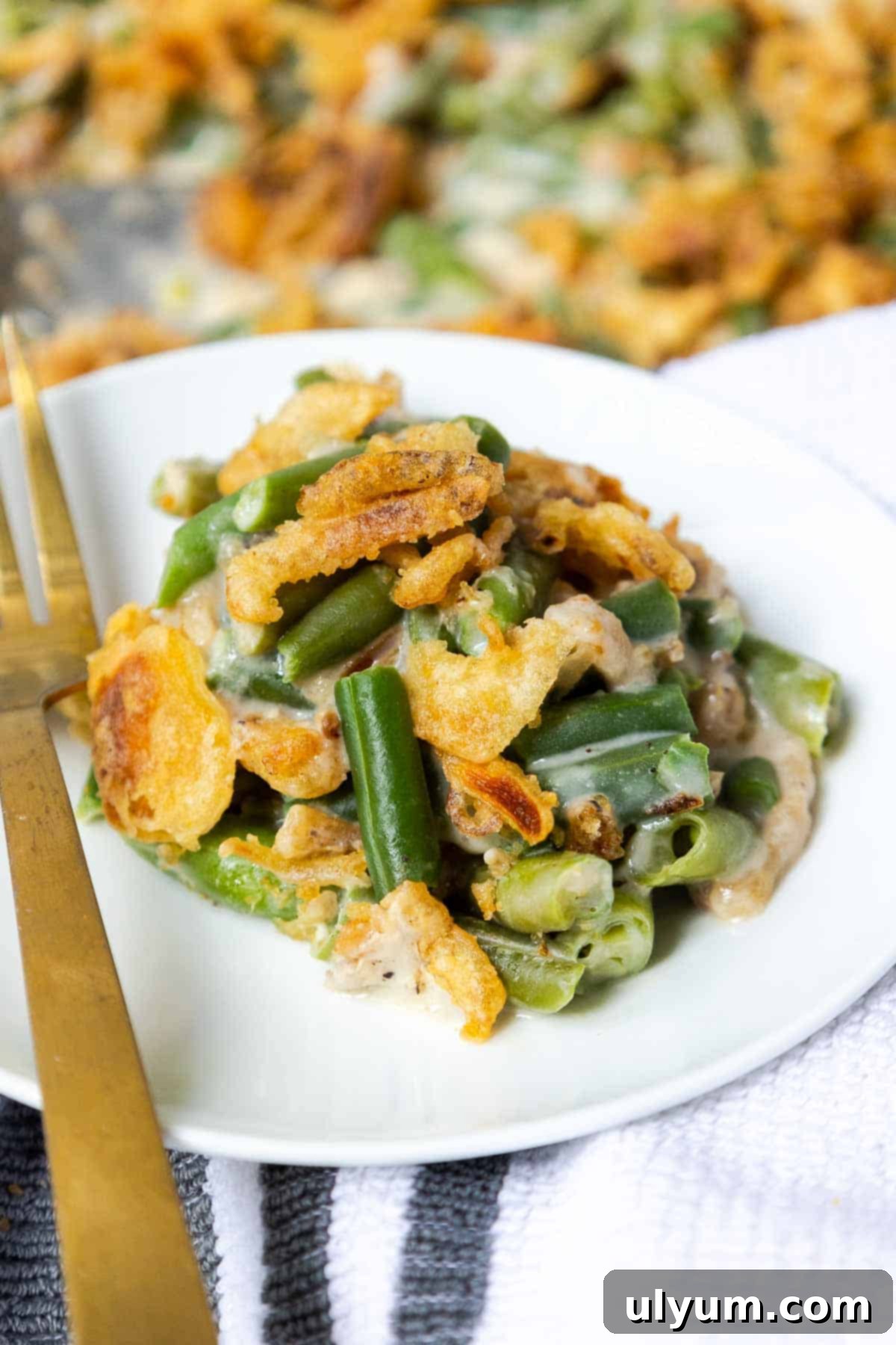 Holiday-Sized Green Bean Casserole 8 Green bean casserole served on a small plate.