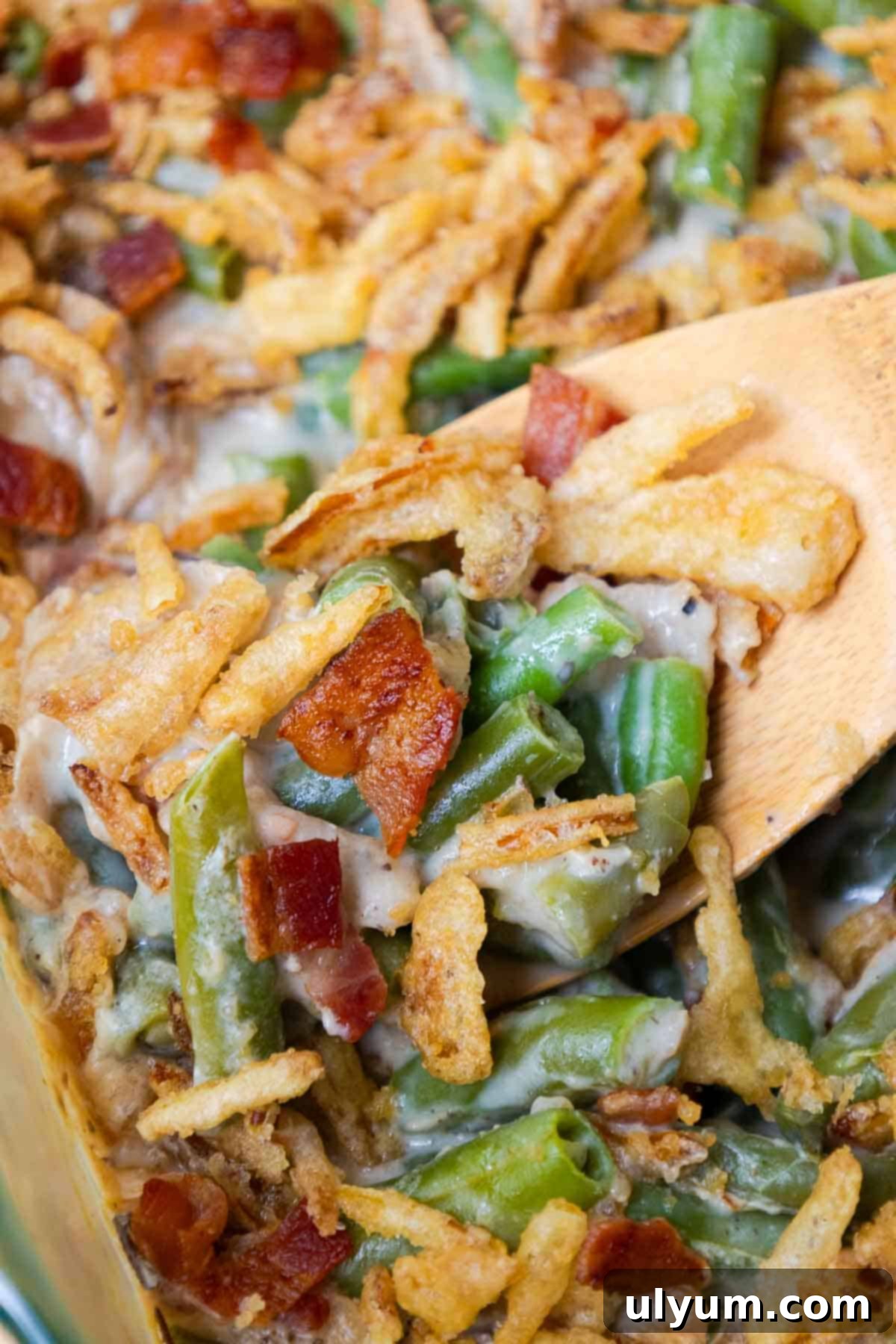 Green bean casserole with bacon and crispy fried onions.