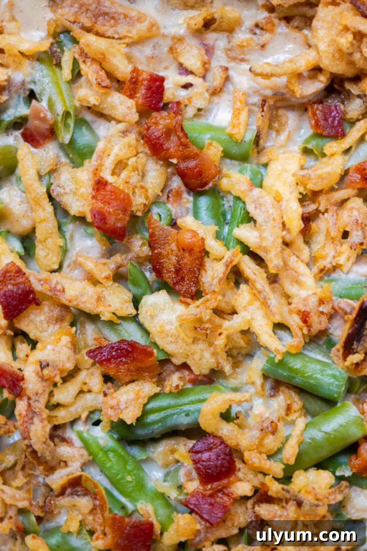 Green bean casserole with bacon and crispy fried onions.